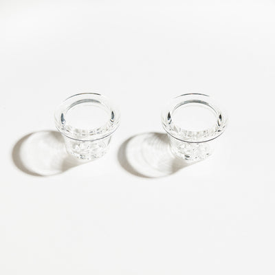 two 9-hole glass pipe bowls in a white background