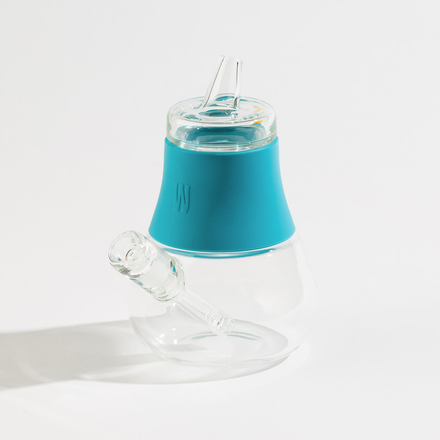 an aqua silicone and glass bubbler on a white background.