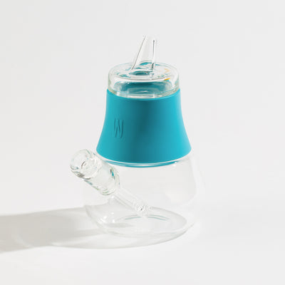 an aqua silicone and glass bubbler on a white background.