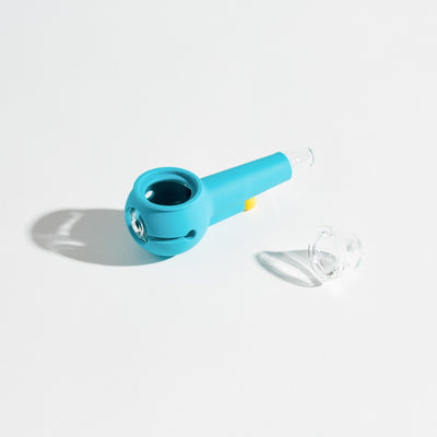 A sky silicone and glass pipe, disassembled on a white background.