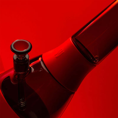 black glass bong with red cover closeup 