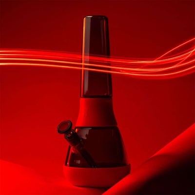 black glass bong with red cover. styled with racing light against a red background 
