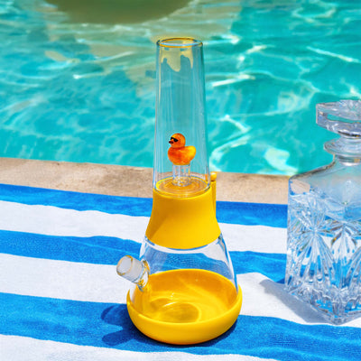 duck percolator bong poolside on a towel 