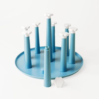 blue drying rack against white background 