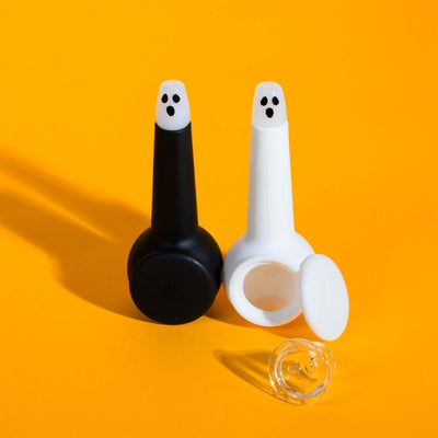 Black and white ghost pipes with clear pipe bowl and yellow backdrop 