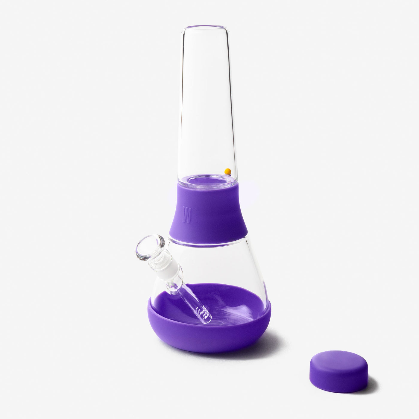 Detachable glass bong with grape purple silicone covers on a white background.