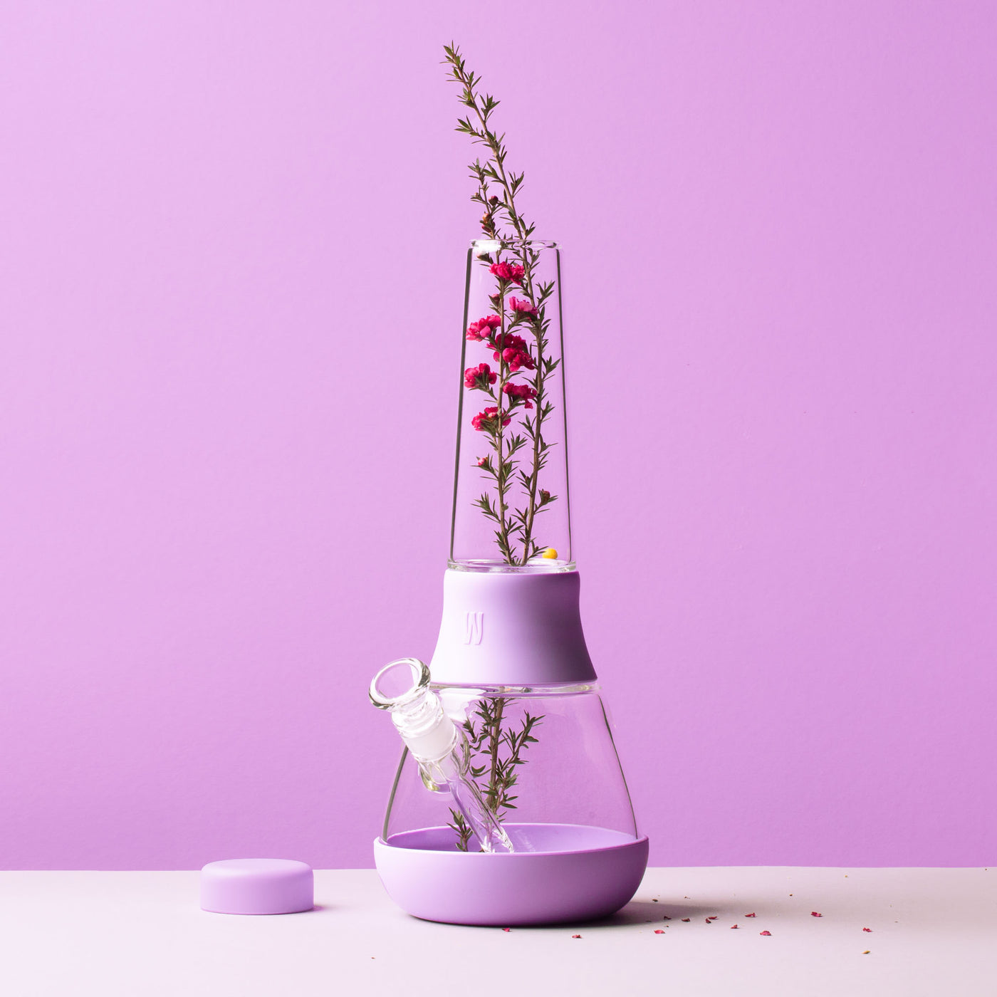 bong with clear glass and lavender cover with lavender plant inside tube