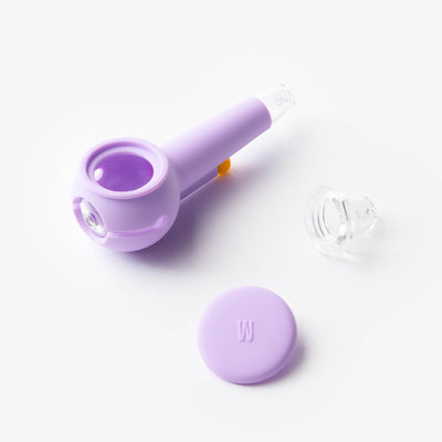  a lavender silicone and glass pipe with pipe bowl disassembled on a white background.