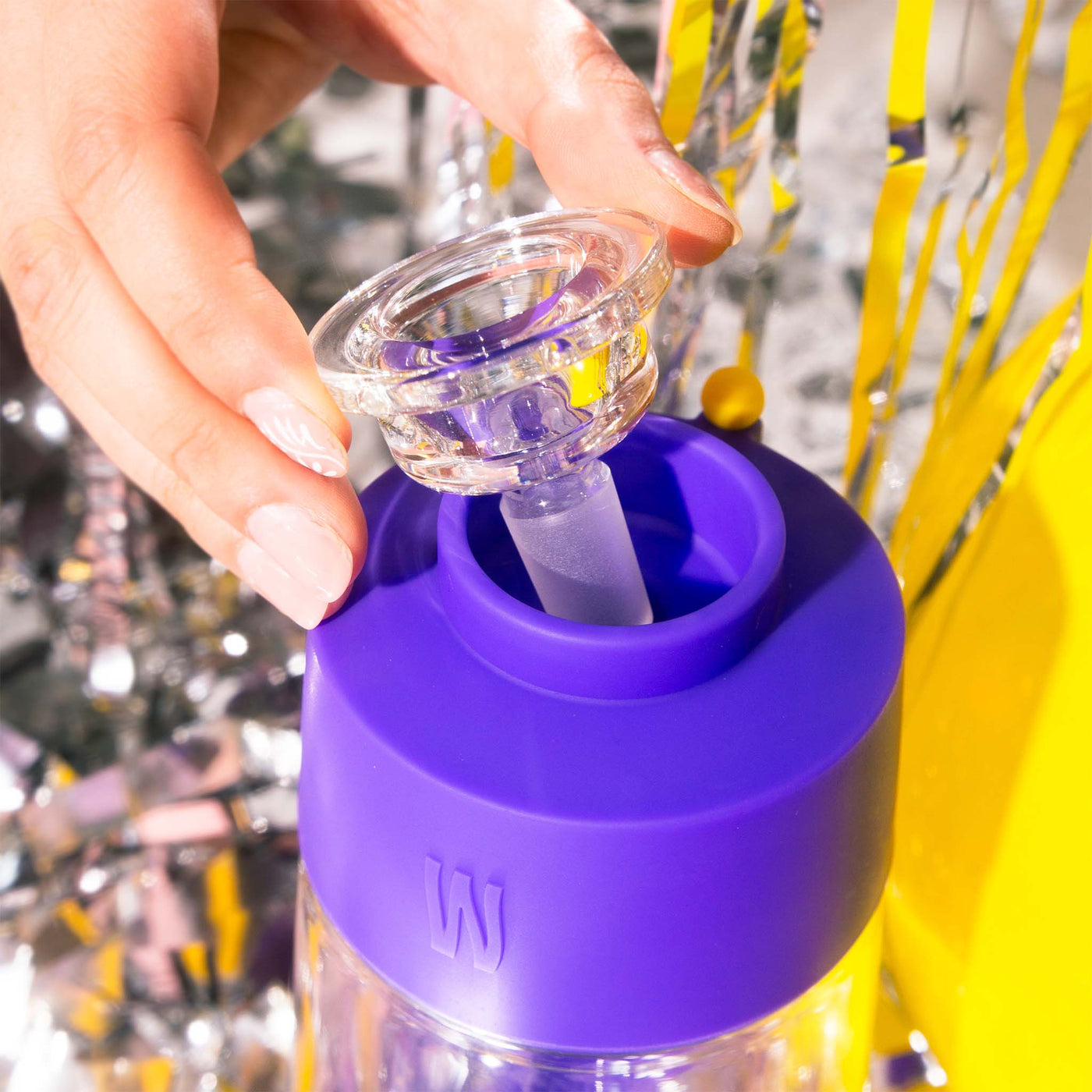 model taking out 14mm gravity bong bowl close up