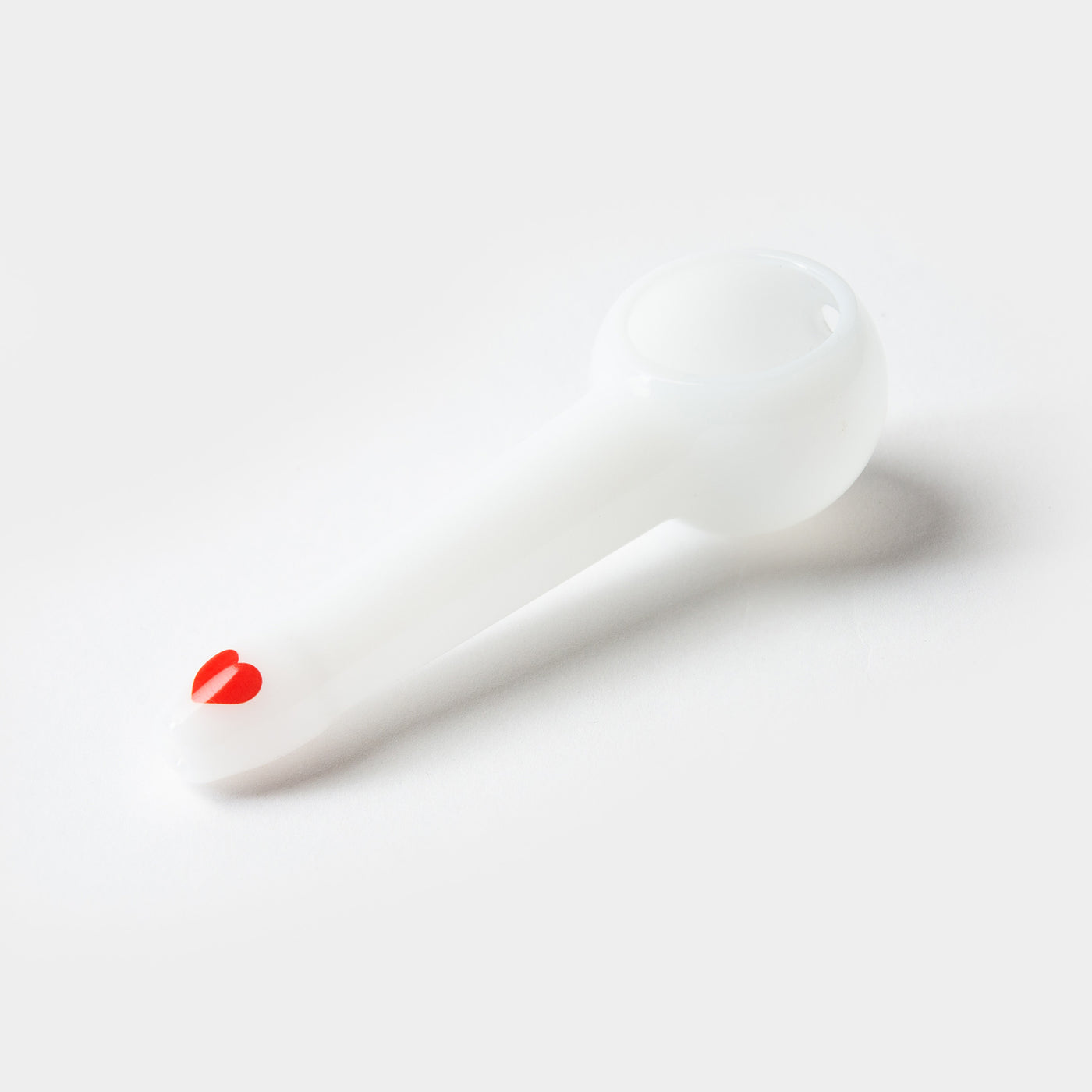 White pipe base with red heart decal on a white background. 