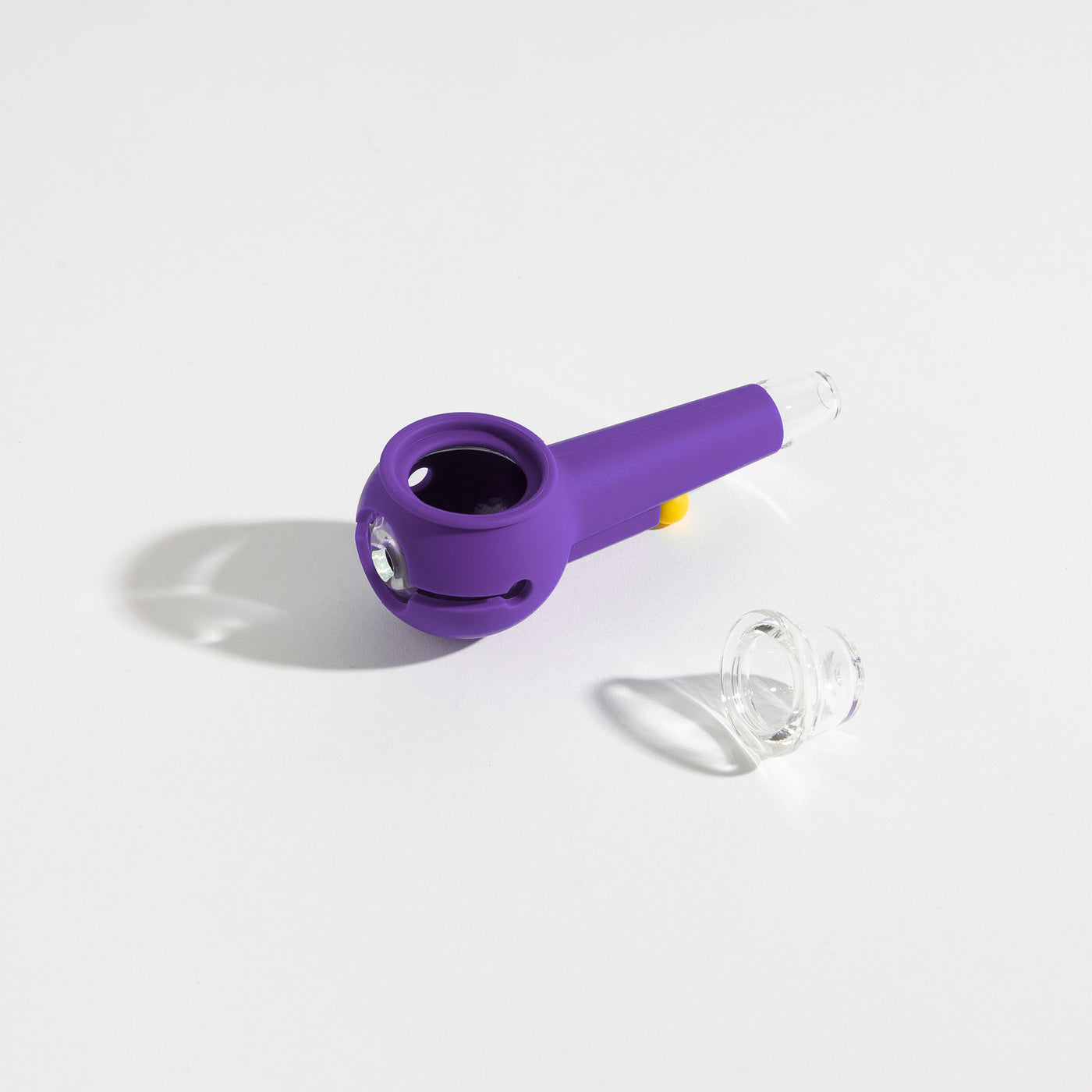 Grape purple silicone pipe with detachable glass bowl on a white background.