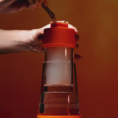 pumpkin orange gravity bong in use 