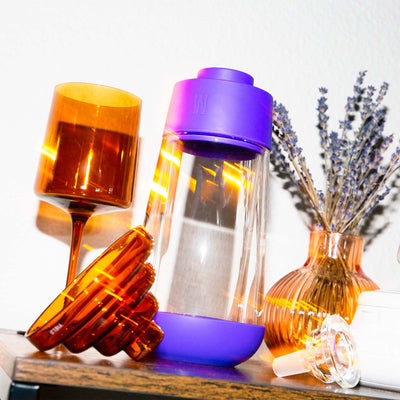 purple gravity bong styled with home decor 