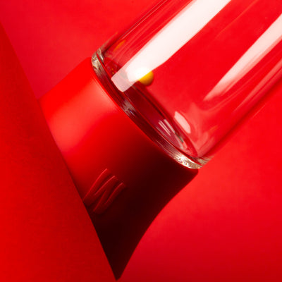 clear glass bong closeup of red cover 