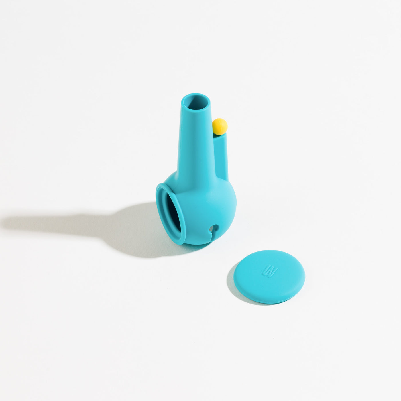 Aqua blue silicone pipe protector standing in a white background with cap aside 