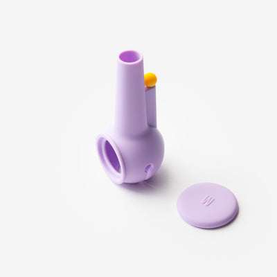 Lavender silicone pipe protector standing in a white background with cap aside 