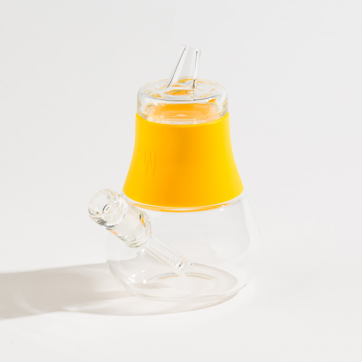 a sunshine silicone and glass bubbler on a white background.