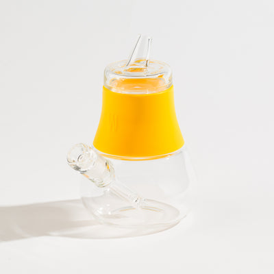 a sunshine silicone and glass bubbler on a white background.