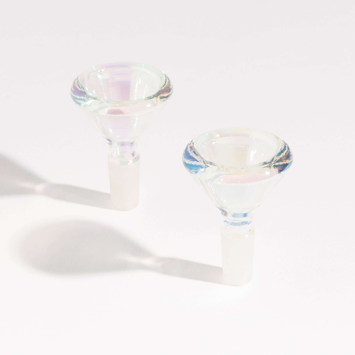 Two iridescent borosilicate glass bong bowls for enhanced smoking experience, sitting side by side.