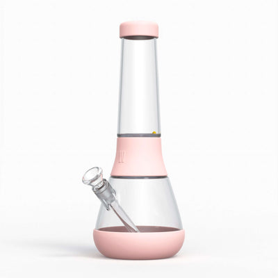 A designer glass bong with protective silicone covers in baby pink.