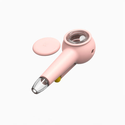 Top view of a cute baby pink glass bowl pipe, with the cap uncovered.