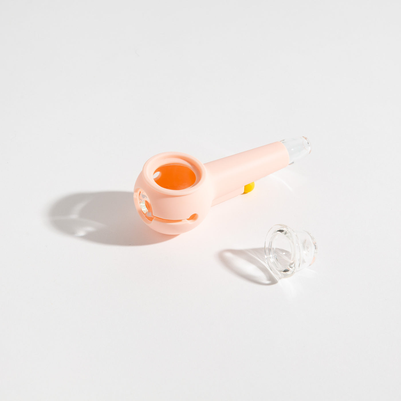 Product photo of an easy-to-clean baby pink glass pipe with separated bowl for an enjoyable smoking experience.