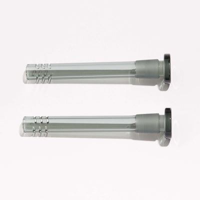 Two black borosilicate slitted downstems for enhanced filtering, sitting side by side.