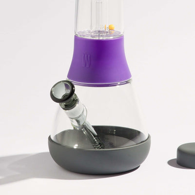 clear bong glass with grape and black silicone, with black bowl and white background 