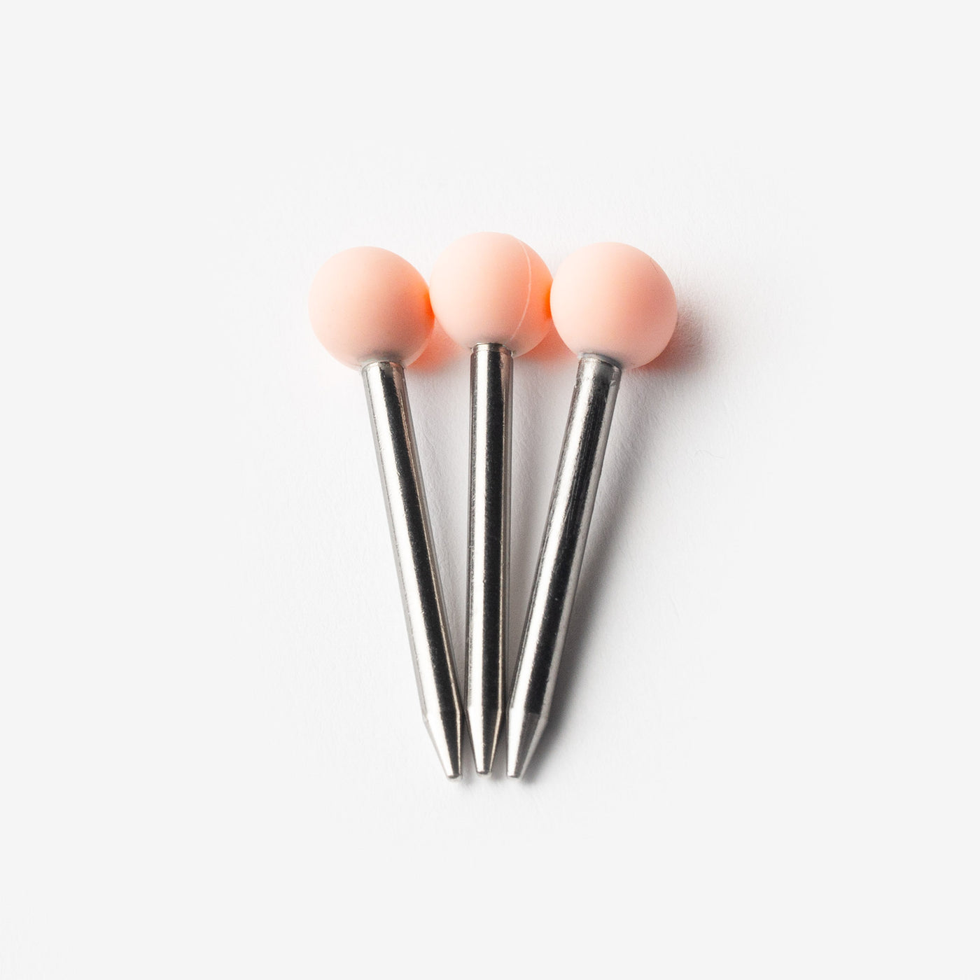 Bubble gum pink pokers in three, white background