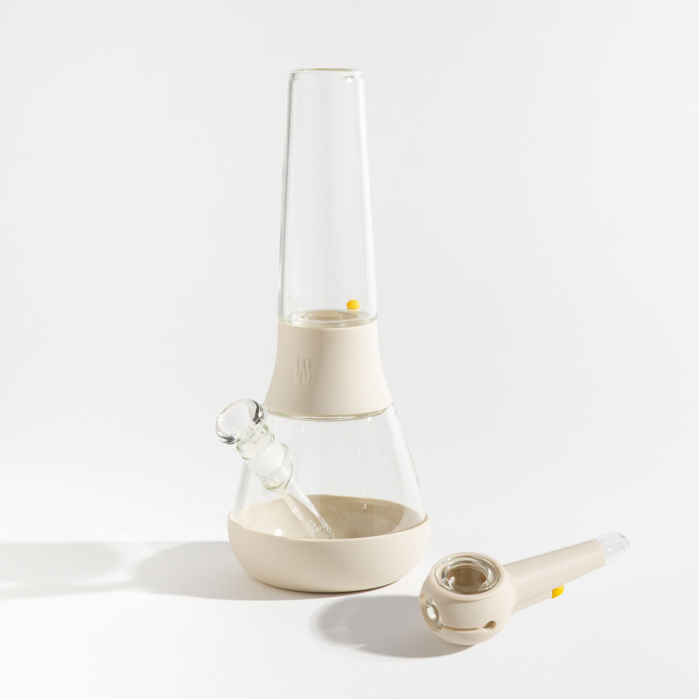 A bundle set of the Weeday modular glass bong and spoon pipe in cream white silicone covers on a white background.