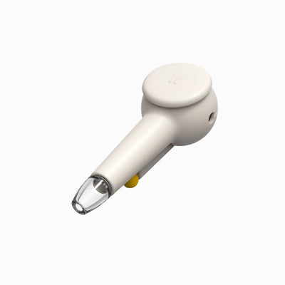 Top view of a designer hand pipe with cream white silicone covers, cap on for protection.
