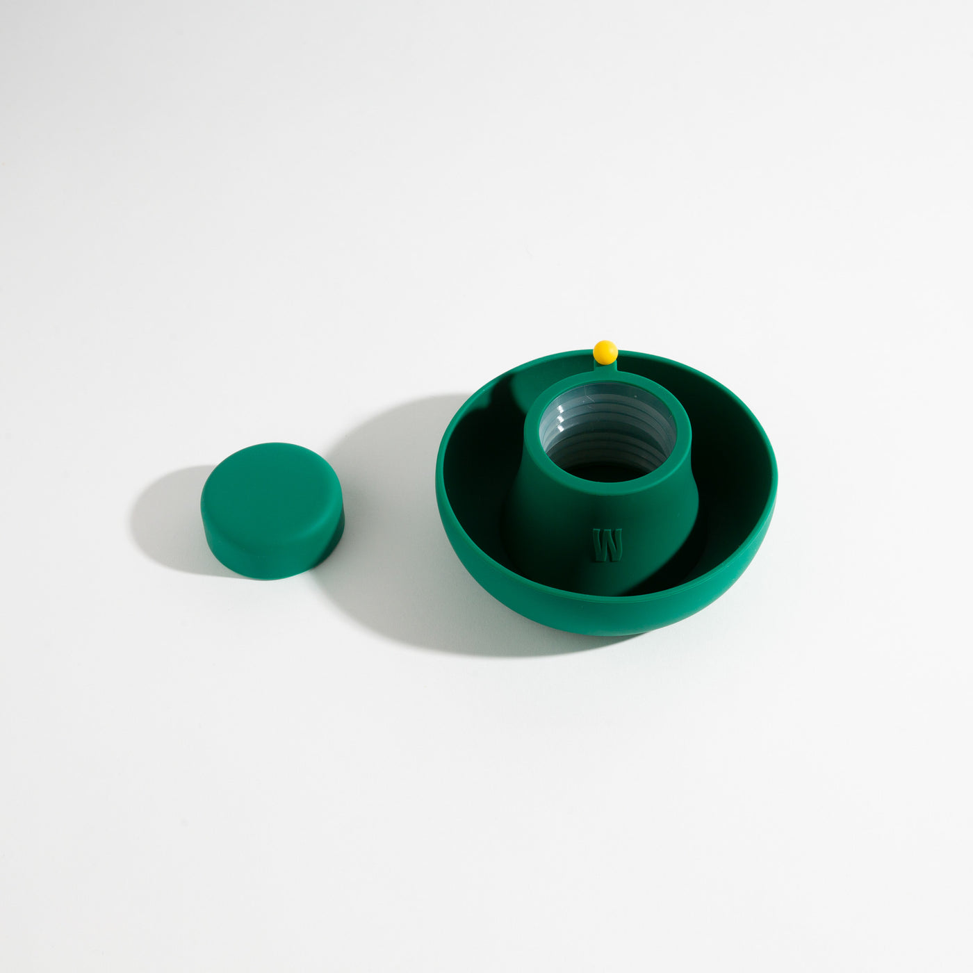 Ultra-soft, dust-resistant forest green silicone covers for glass bong protection, displayed on a table.