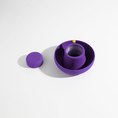 Grape purple silicone bong cover for glass bong protection on a white background