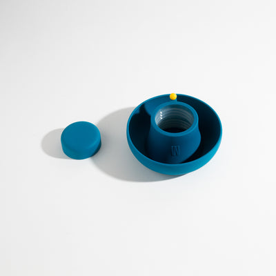 Ultra-soft, dust-resistant midnight blue silicone covers for glass bong protection, displayed on a table.
