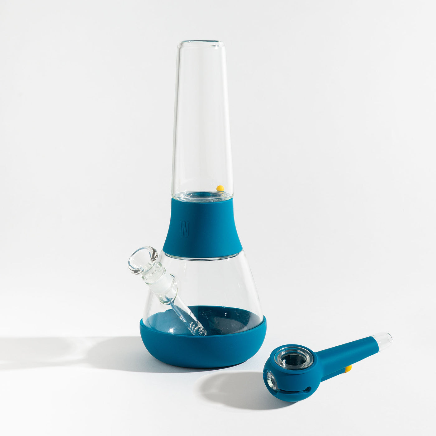 A bundle set of the Weeday modular glass bong and spoon pipe in midnight blue silicone covers on a white background.