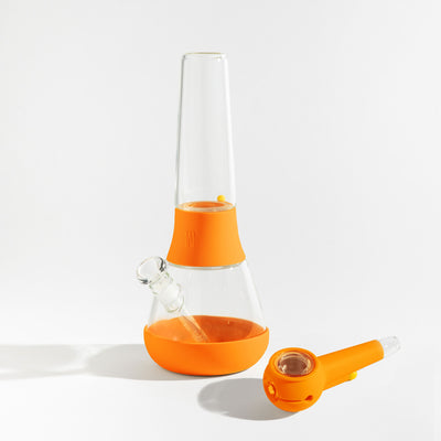 weeday bong and pipe with pumpkin covers and white background 