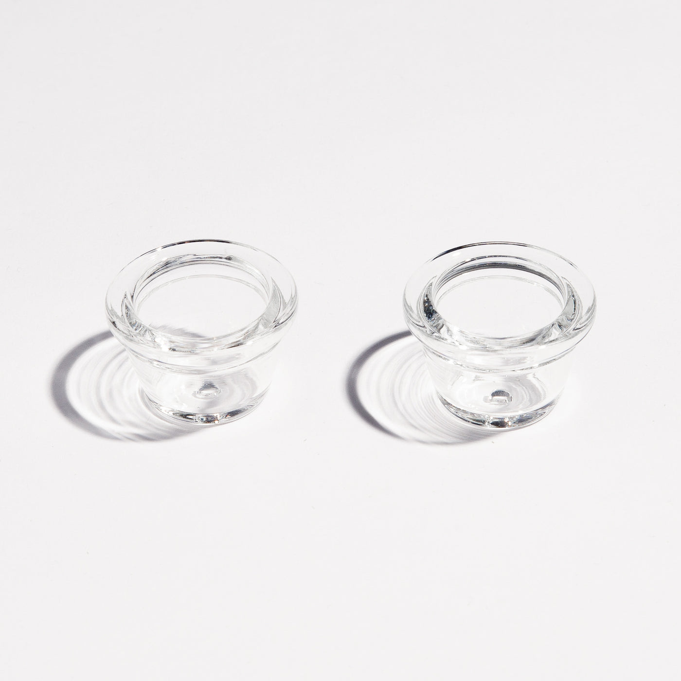 Two premium borosilicate glass pipe bowls for enhanced smoking experience, sitting side by side.