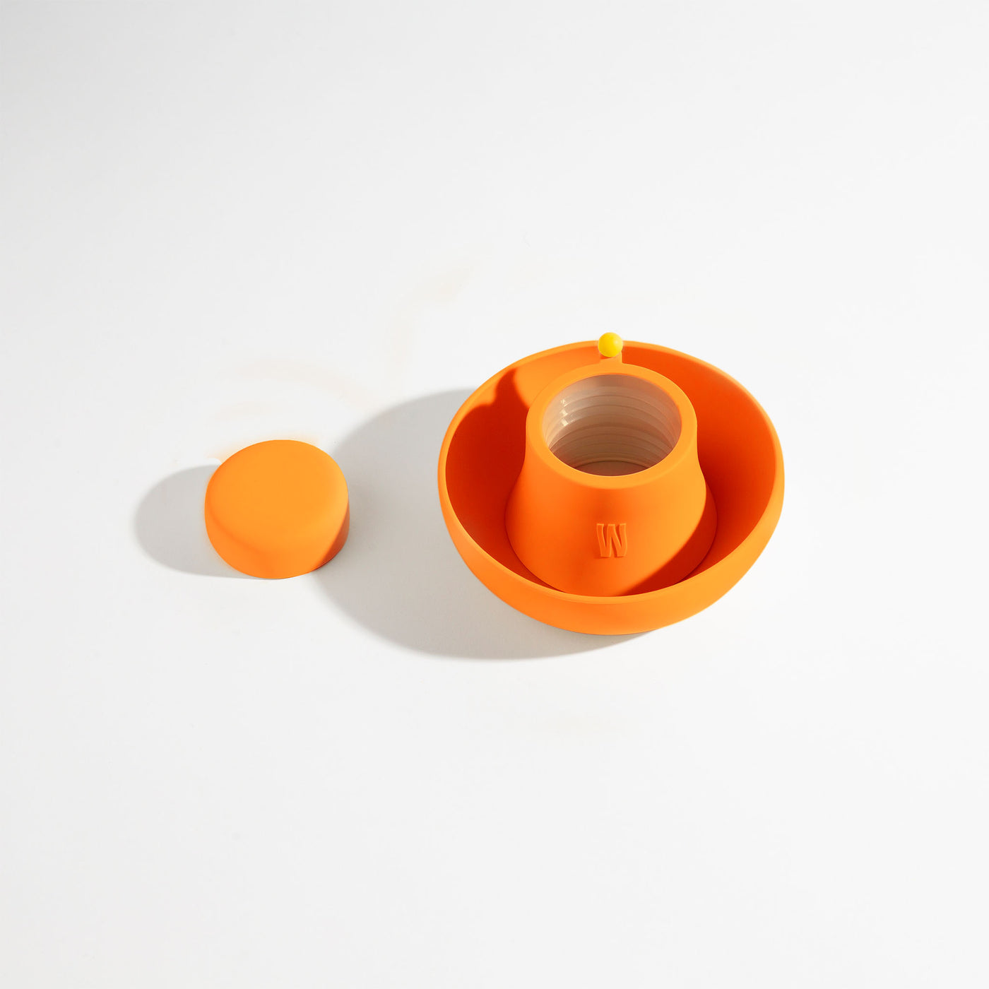 Pumpkin orange silicone bong cover for glass bong protection on a white background