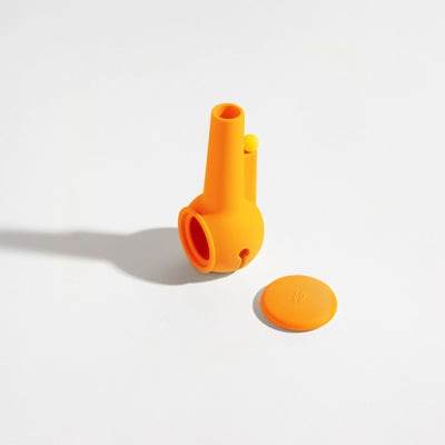 Pumpkin orange silicone pipe cover for glass pipe protection on a white background
