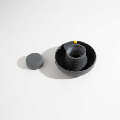 Ultra-soft, dust-resistant smoke gray silicone covers for glass bong protection, displayed on a table.