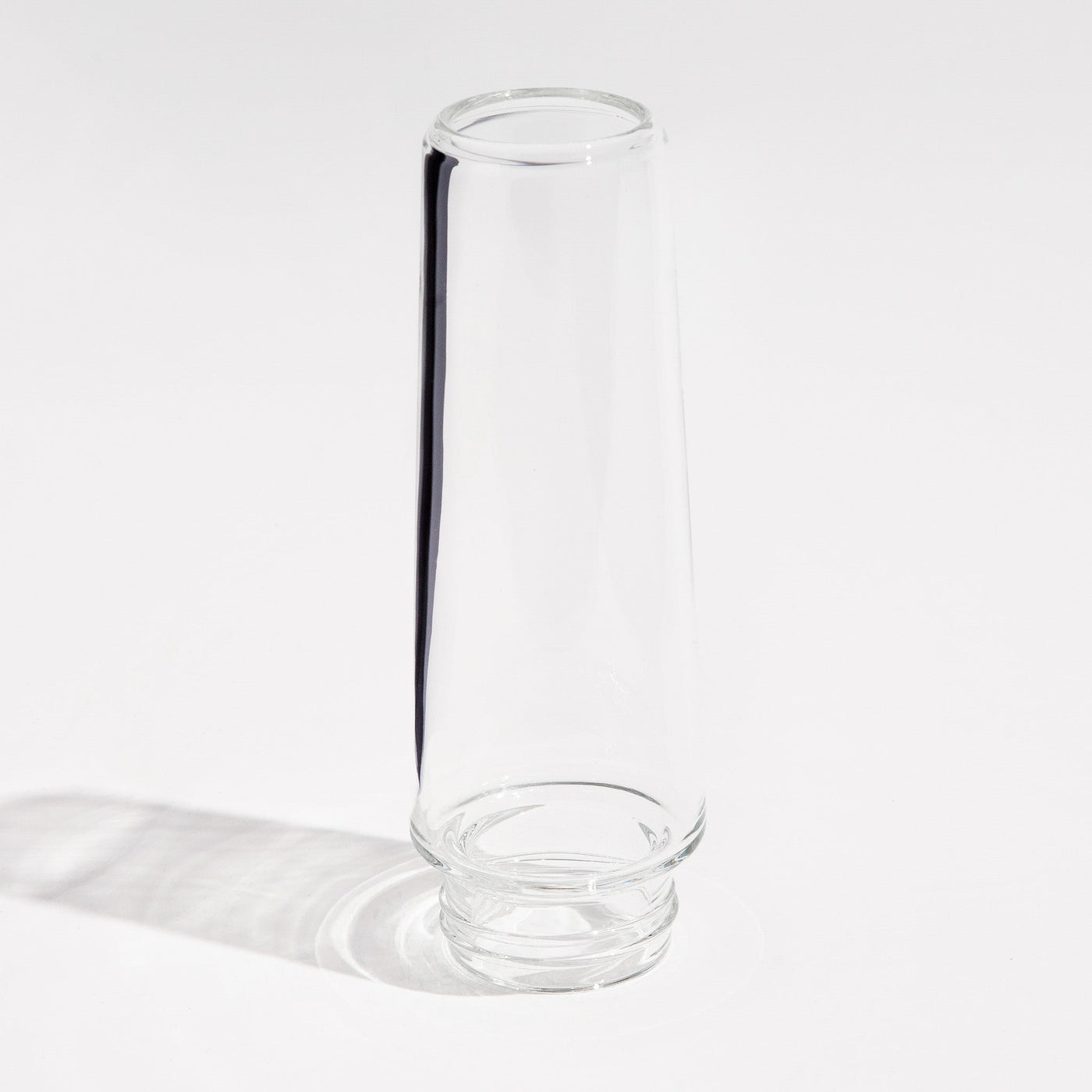 Clear borosilicate glass mouthpiece tube of a Weeday bong on a white background.