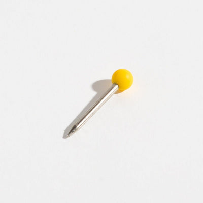 Weeday stainless steel poker with the yellow silicone head on a white background.