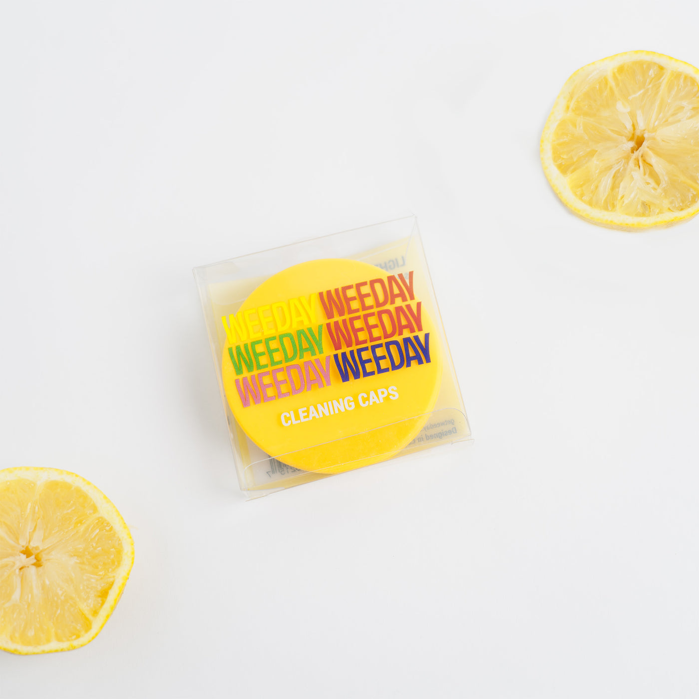 Yellow cleaning cap package with lemons, white background 