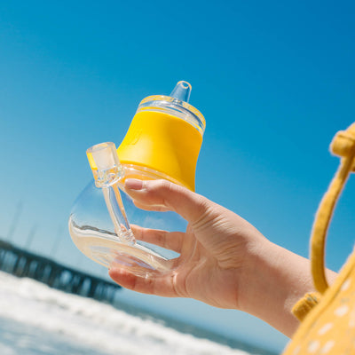 sunshine yellow bubbler at the beach in front of the pier
